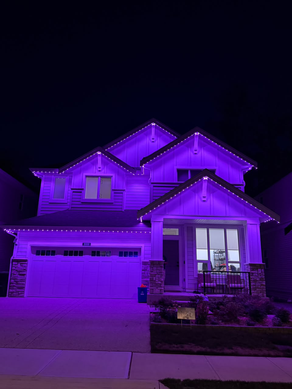 Spooky dramatic purple and violet night illumination along peaks.