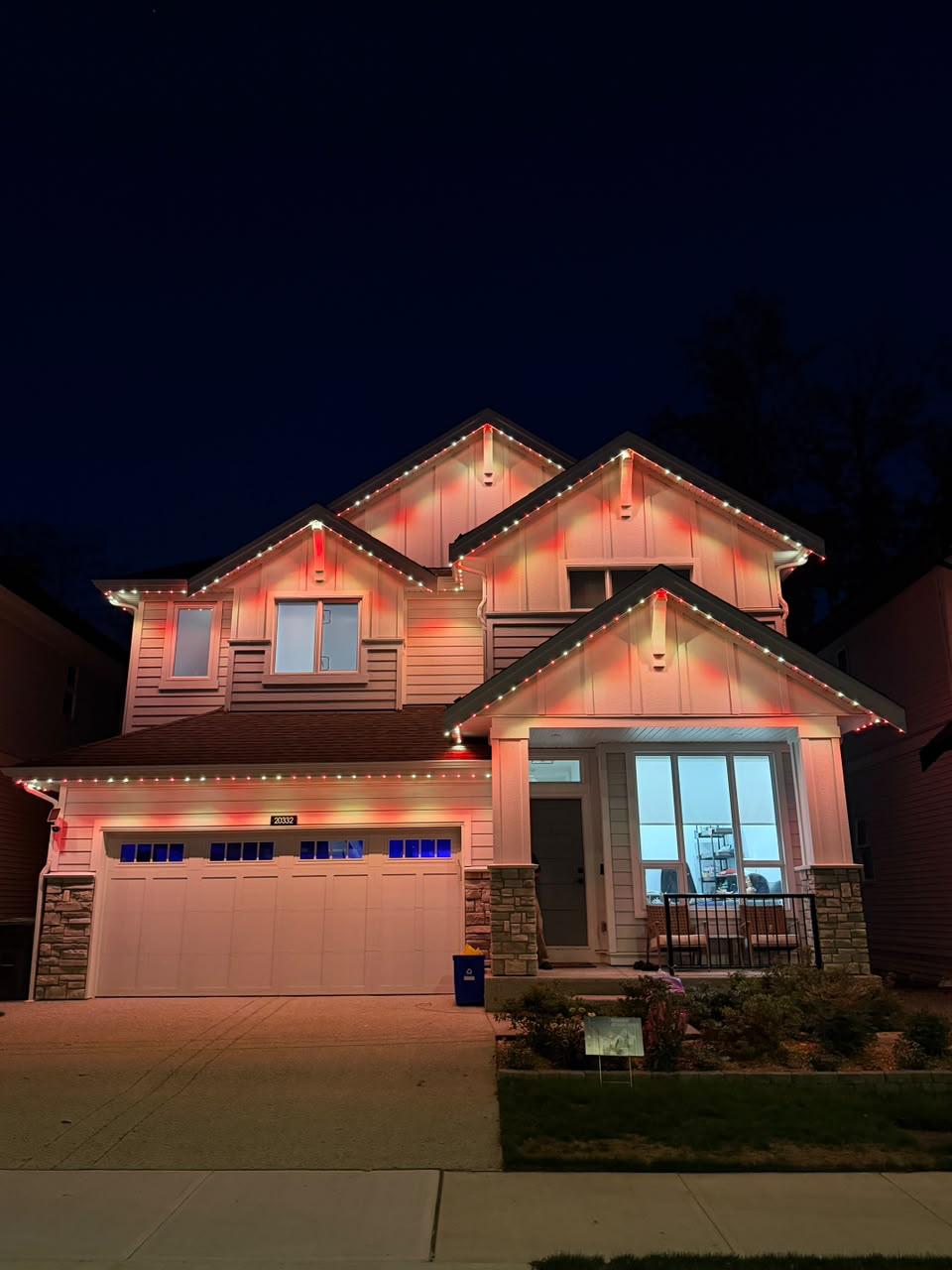 A home in Langford lit in brilliant Canada Day red and white.