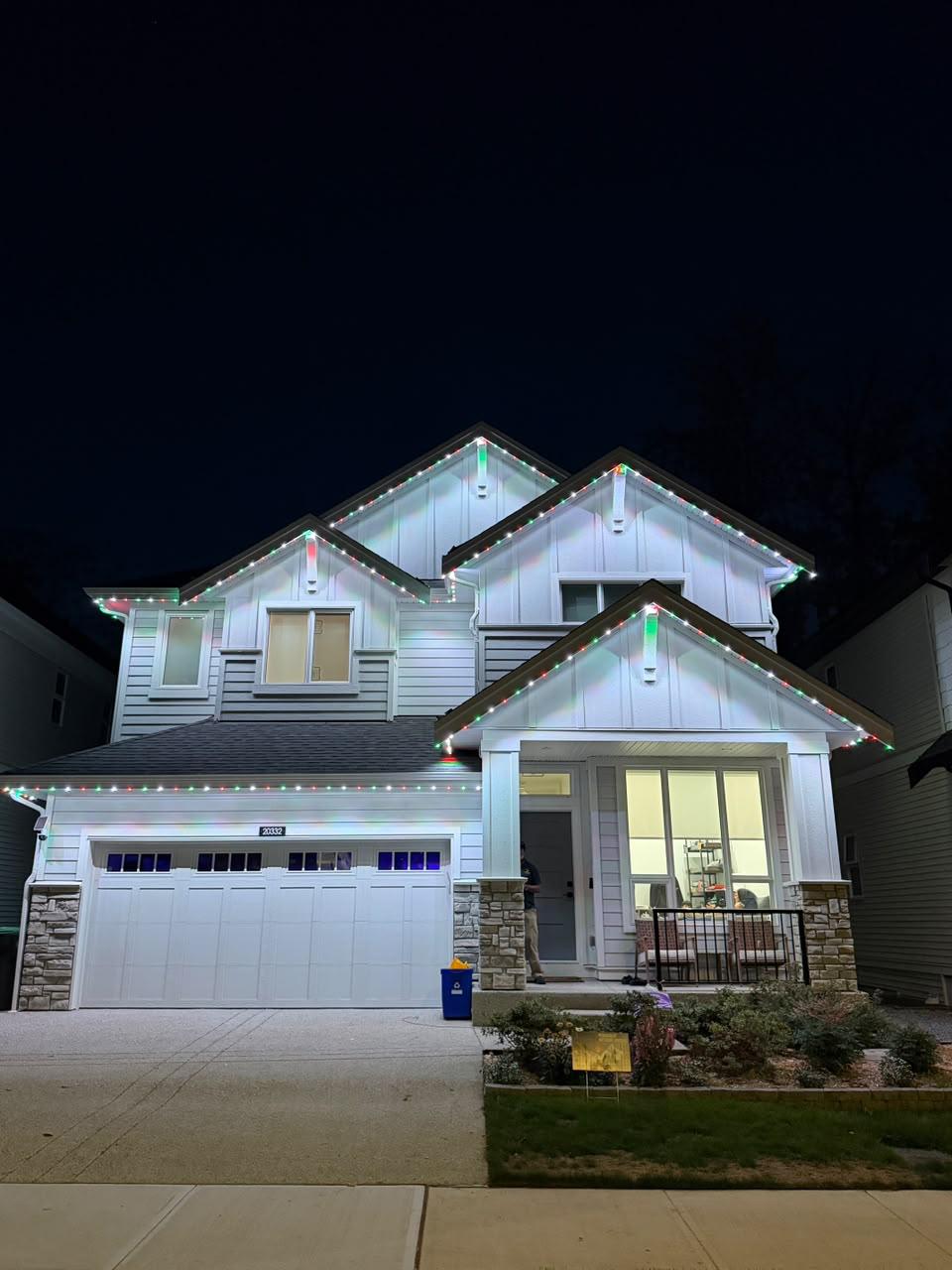 A home in Nanaimo lit in festive red and green holiday patterns.