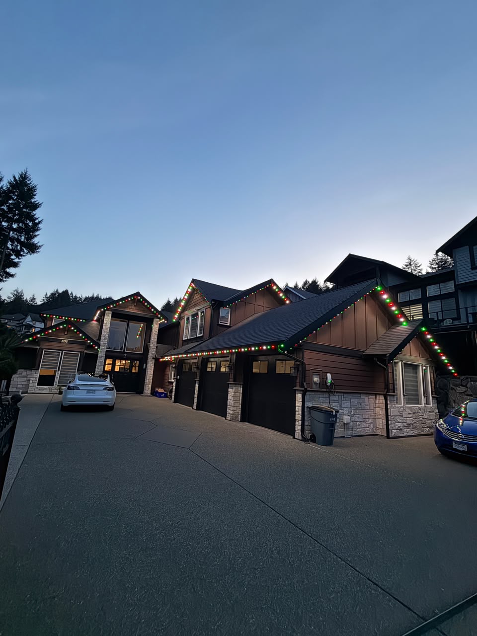 Nighttime look: vibrant permanent outdoor lighting illuminates the estate roofline.